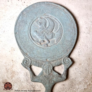 Reproduction of an Etruscan bronze mirror of a woman.