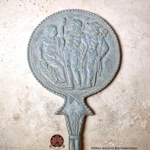 Reproduction of an Etruscan mirror in bronze.