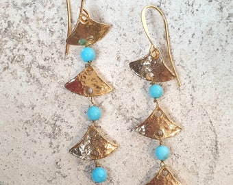 Antique style earrings with three dangling turquoise stones. Craftsmanship, Nickel free.