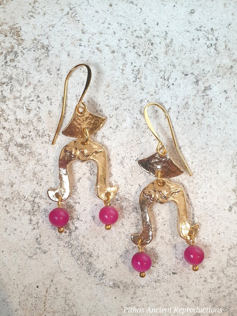 Antique style earrings with two dangling pink jade stones, depicting a snake in the center. Nickel free. image 1