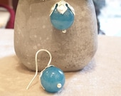 Brass earrings with silver bath. Craftsmanship with blue chalcedony stone