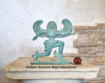 Bronze reproduction depicting a running gorgon.