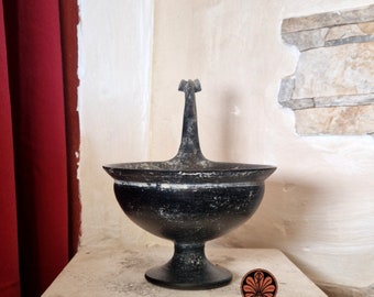 Reproduction of Etruscan Kyathos vase in bucchero. Total height 18 cm.