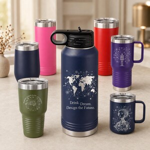 May include: A collection of seven stainless steel tumblers in various colors including navy blue, olive green, pink, red, and purple. Some feature white graphic prints of a world map, a brain, a human figure, and a robot with text like Drink. Dream. Design the Future.