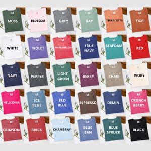May include: A color chart of 25 different colors of t-shirts. The colors include moss, blossom, grey, bay, terracotta, yam, white, violet, watermelon, true navy, seafoam, red, navy, pepper, light green, berry, khaki, ivory, heliconia, ice blue, flo blue, espresso, demin, crunch berry, crimson, brick, chambray, blue jean, blue spruce, and black.