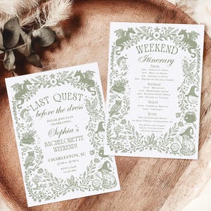 May include: Two white invitation cards with green floral and whimsical illustrations, including owls and witch hats, are displayed on a wooden tray. The cards read "Last Quest before the dress" and "Weekend Itinerary" with event details.