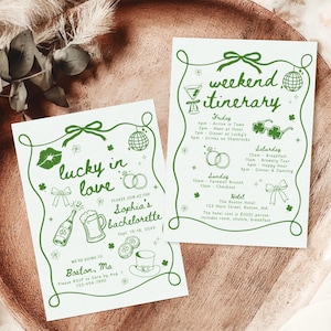 Puede incluir: Dos tarjetas blancas con texto e ilustraciones verdes, dispuestas sobre una bandeja de madera. Una tarjeta dice "lucky in love" y la otra "weekend itinerary". Las tarjetas son para una despedida de soltera en Boston, MA.