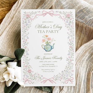May include: A Mother's Day Tea Party invitation with floral and bow accents. The invitation features a teapot illustration and the text "Join us for a Mother's Day Tea Party". The invitation is on a white background.