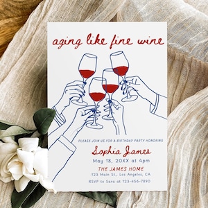 May include: A white birthday invitation card with the words "aging like fine wine" in red script. The card features a line drawing of hands toasting with wine glasses filled with red wine. The invitation is for Sophia James' birthday.