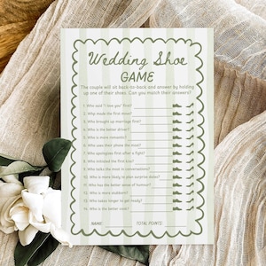 May include: A rectangular wedding shoe game card featuring a light green and white striped background with a scalloped border. The text reads Wedding Shoe GAME, followed by fourteen questions with shoe icons for answers, and lines for name and total points.