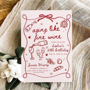 May include: A light pink invitation card with a red wine-themed illustration. The text "aging like fine wine" is displayed, along with details for Sophia's 50th birthday. The card is decorated with wine glasses, grapes, and a disco ball.