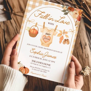 May include: A baby shower invitation with a fall theme. The design features a gingham pattern, pumpkins, and the text "Fall in Love with Baby James." The invitation includes details for Sophia James' baby shower.
