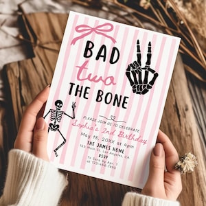 May include: A pink and white striped birthday invitation with the text "BAD twa THE BONE". The invitation features a skeleton illustration, a bow, and the details for Sophia's 2nd birthday party.