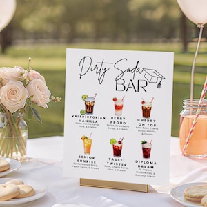 May include: A white sign with the words "Dirty Soda Bar" in elegant script, featuring illustrations of various soda concoctions. The sign includes drink names like "Valedictorian Vanilla" and "Cherry on Top."