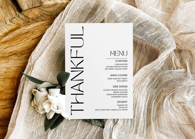 May include: A white card with black text that reads "THANKFUL" on the left side and a Thanksgiving menu on the right side. The menu includes starters, main course, side dishes, and dessert.