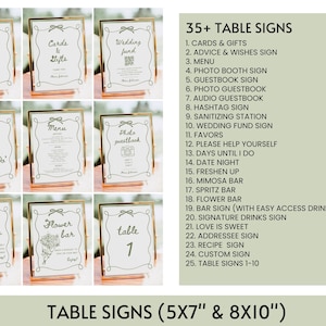 May include: A set of 10 gold-framed table signs with various wedding-related text, such as "Love is Sweet", "Cards & Gifts", and "Wedding Fund". The signs are 13 cm x 18 cm and 20 cm x 25 cm.