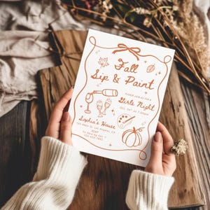 May include: A white invitation card with copper-colored text and line art. The text reads Fall Sip & Paint, Please join us for a Girls Night, Oct. 14th at 7:00pm, Sophia's House, 123 Main St. Los Angeles, CA, RSVP To Sara by Oct. 1, 123-456-7890.