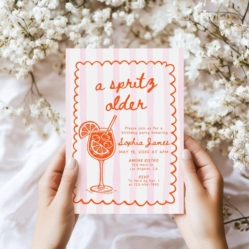 May include: A pink and white striped invitation with the text "a spritz older" and an illustration of a cocktail. The invitation is for a birthday party honoring Sophia James, with details including the date, time, and location.