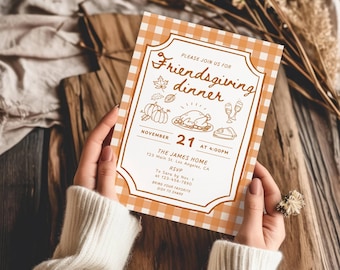 May include: A rectangular Friendsgiving dinner invitation card with an orange and white gingham border. The center features brown line art of pumpkins, a turkey, and wine glasses, with text including November 21 at 4:00PM, The James Home, and RSVP details.