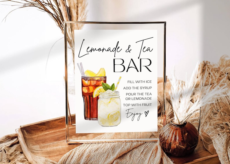 May include: A framed sign with the words "Lemonade & Tea BAR" in elegant script. Watercolor illustrations of iced tea and lemonade are featured. Instructions for making the drinks are also included.