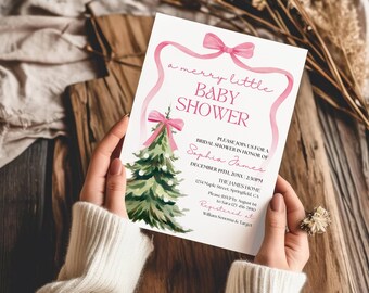 May include: A white rectangular baby shower invitation card featuring a watercolor green Christmas tree with a pink bow and a pink ribbon border. The text reads: a merry little BABY SHOWER, PLEASE JOIN US FOR A BRIDAL SHOWER IN HONOR OF Sophia James, DECEMBER 19TH, 20XX, 2:30PM, THE JAMES HOME, 1234 Maple Street, Springfield, CA, Please RSVP by August 1st to Sara 123-456-7890, Registered at William Sonoma & Target.