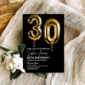 May include: Black and white birthday party invitation with gold foil balloons in the shape of the number 30. The text reads "Please join us in celebrating Sophia James' 30th Birthday! January 31st, 20XX at 8:00PM The James Home 123 Anywhere Street, Any City, CA, 12345 Please RSVP by August 1st to Sara 404-484-7890"