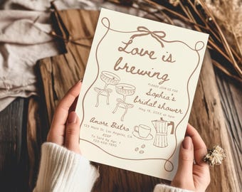 Puede incluir: Una tarjeta de invitación color crema para despedida de soltera con dibujos de líneas marrones y el texto Love is brewing, Sophia's bridal shower, May 18, 20XX at 4pm, Amore Bistro, 123 Main St. Los Angeles, CA, RSVP to Sara by Apr. 1, 123-456-7890.