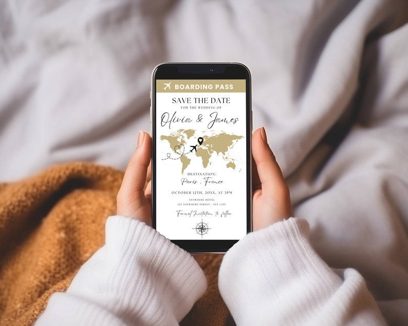 May include: A smartphone screen displays a save the date announcement for a wedding. The announcement is styled like a boarding pass with a world map and the text "Save the Date for the Wedding of Olivia & James. Destination: Paris, France. October 12th, 2023, at 3PM."