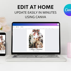 May include: A laptop computer with a screen displaying a Christmas card design in Canva. The card features a family photo with a red and black plaid bow. The text on the card reads "Merry Christmas".