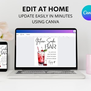 Op de afbeelding: Een digitale mockup van een printbaar bord voor een Hatian Soda Bar. Het bord toont een aquarel-illustratie van een glas soda met een kers erop. De tekst op het bord luidt "Hatian Soda Bar" en bevat instructies voor het maken van de soda: "Vul met ijs, voeg de siroop toe, giet de soda, top met room, Geniet!"
