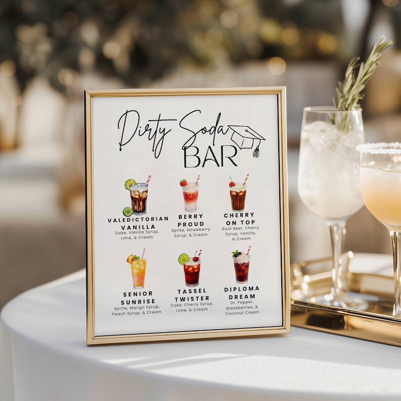 May include: A framed sign with a gold border displays the words "Dirty Soda Bar" and illustrations of six soda cocktails. The cocktails are labeled with names like "Valedictorian" and "Berry Proud", with ingredients listed below each.