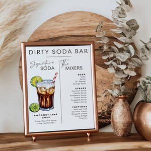 May include: A printable sign for a dirty soda bar with a watercolor illustration of a coconut lime coke drink. The sign lists the soda, syrups, and toppings available for the bar.
