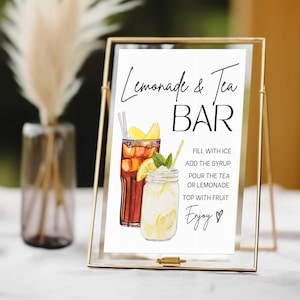 May include: A gold-framed sign with the words "Lemonade & Tea BAR" in black script. The sign features watercolor illustrations of iced tea and lemonade, with instructions and the word "Enjoy!" in script.