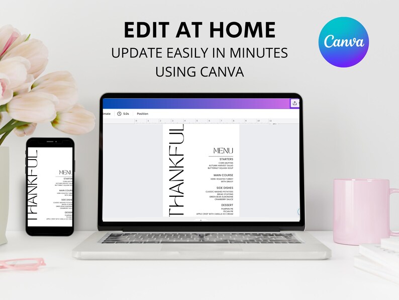May include: A laptop computer screen displaying a menu template with the word "THANKFUL" in bold, black text. The menu template is open in Canva, a graphic design platform. The laptop is on a white desk with a pink mug and a white flower arrangement.