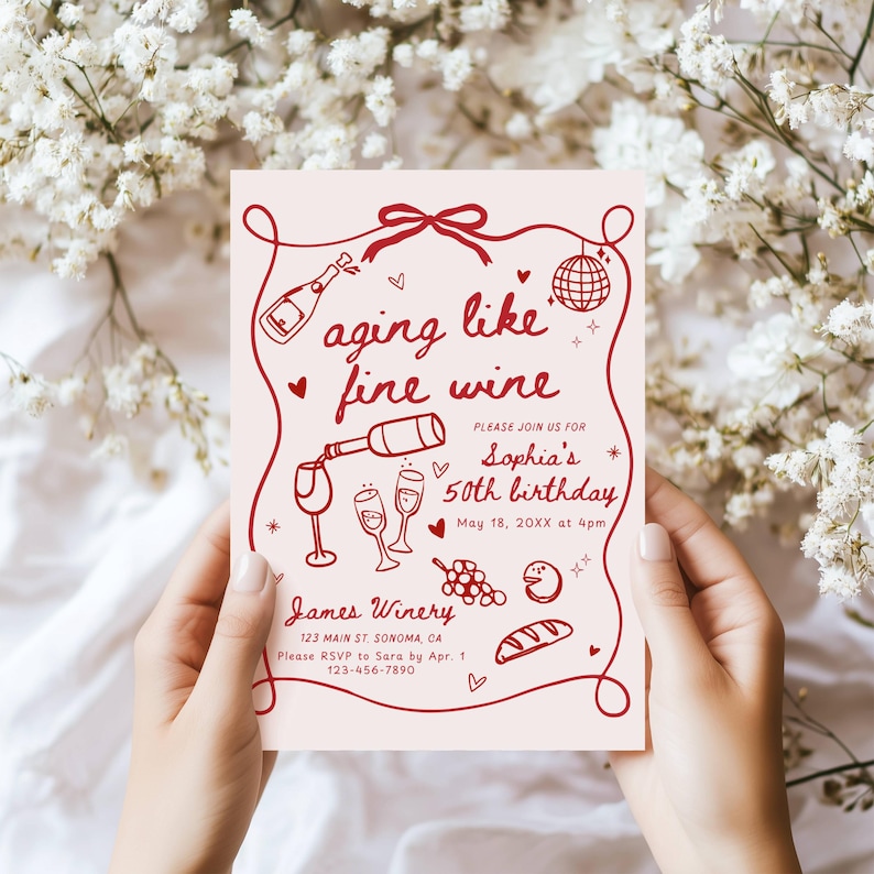 May include: A pink invitation card with red illustrations and text. The card reads "aging like fine wine" and invites guests to Sophia's 50th birthday. Includes wine-themed graphics and winery details.