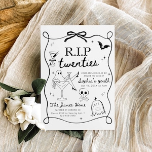 May include: A white invitation card with black line art, featuring the text "R.I.P twenties" and a ghost in a martini glass. The card includes event details and is set against a beige fabric and wooden surface.