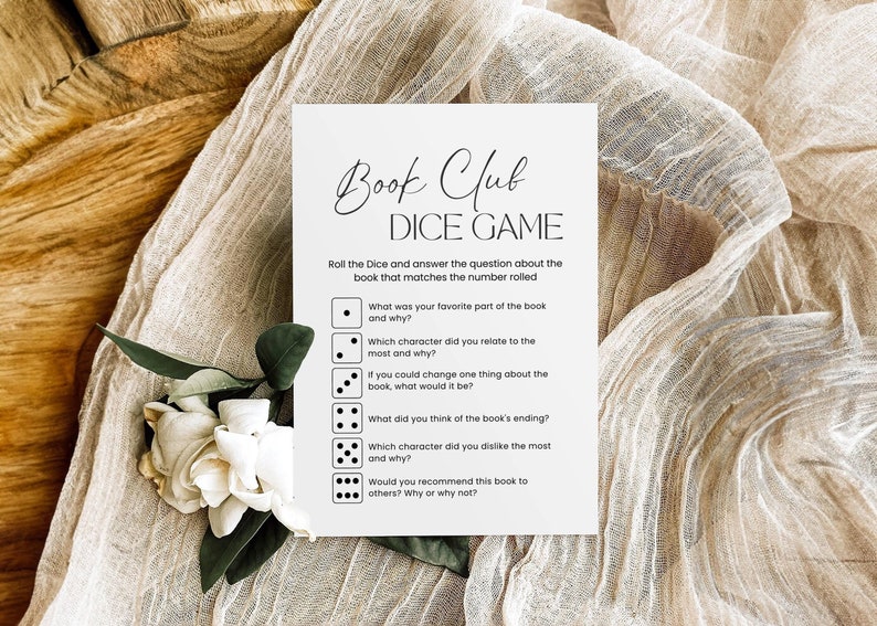 Pode incluir: Um cart&atilde;o de jogo de dados de clube do livro imprim&iacute;vel em preto e branco com instru&ccedil;&otilde;es para rolar os dados e responder &agrave; pergunta que corresponde ao n&uacute;mero rolado. As perguntas incluem: Qual foi a sua parte favorita do livro e porqu&ecirc;? Com qual personagem voc&ecirc; mais se identificou e porqu&ecirc;? Se voc&ecirc; pudesse mudar uma coisa no livro, o que seria? O que voc&ecirc; achou do final do livro? Qual personagem voc&ecirc; menos gostou e porqu&ecirc;? Voc&ecirc; recomendaria este livro a outras pessoas? Por que sim ou por que n&atilde;o?
