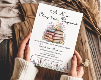 May include: A white rectangular bridal shower invitation card featuring the text A New Chapter Begins, a stack of illustrated books topped with colorful wildflowers, and event details for Sophia James on September 23rd at 2:30 PM.