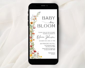 May include: A smartphone displaying a digital baby shower invitation with the text BABY in BLOOM. The design features a vertical arrangement of watercolor wildflowers in shades of orange, pink, yellow, and green along the left side.