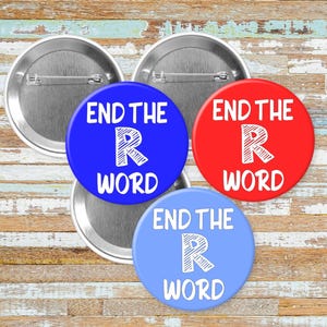 May include: A collection of four round buttons with the text "END THE R WORD". The buttons are in blue, red, and light blue, with white text and a stylized "R". The backs of the buttons are silver.