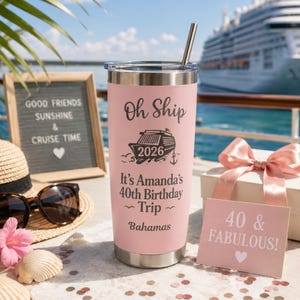May include: A pink travel tumbler with a silver straw, featuring the text "Oh Ship 2026" and "It's Amanda's 40th Birthday Trip Bahamas." A sign reads "40 & Fabulous!" with a heart. A cruise ship is in the background.