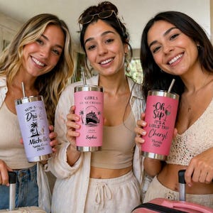 May include: Three women holding personalized travel tumblers. One tumbler is lavender with "Sun, Sand, and Drinks" text, another is pink with "Girls Gone Cruisin" text, and the last is red with "Oh Sip" text. Each tumbler has a straw.