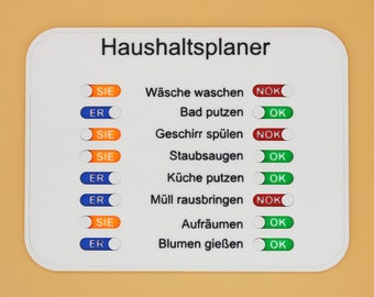 May include: A white board with the title "Haushaltsplaner" and a list of household chores with checkboxes next to each. The checkboxes are labeled "SIE" and "ER" and have a green "OK" or red "NOK" circle next to them.