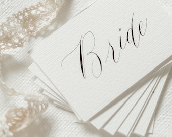 Tarjeta de lugar de caligrafía personalizada Texto negro Configuración de la mesa de bodas Nombre de la boda Tarjeta con letras a mano Escort Ensayo Cena navideña Evento elegante