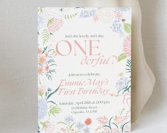May include: A floral-themed first birthday invitation with a pink and white color scheme. The invitation reads "Isn't she lovely, isn't she ONE derful?" and "Join us to celebrate Emmie May's First Birthday." The invitation also includes the date, time, and address of the party.