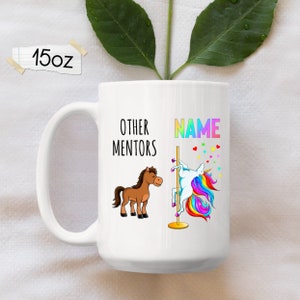 May include: White ceramic mug featuring a brown horse and a rainbow unicorn on a pole. The text on the mug reads "Other Mentors" and "NAME".