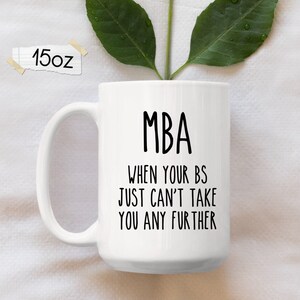 May include: White ceramic coffee mug with a black design that reads "MBA When your BS just can't take you any further".