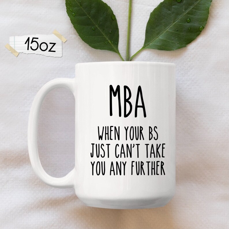 May include: White ceramic coffee mug with a black design that reads "MBA When your BS just can't take you any further".