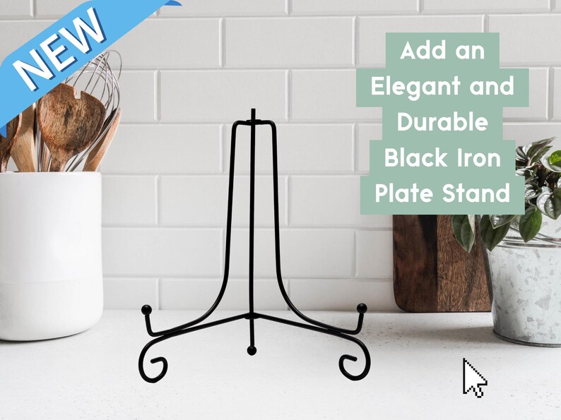 May include: A black iron plate stand with a central vertical support and two curved base arms featuring scroll-style feet. The text on the image reads: NEW, Add an Elegant and Durable Black Iron Plate Stand.