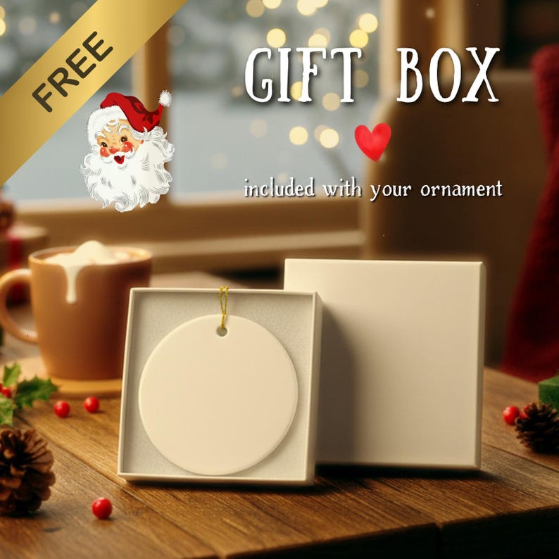 a gift box with a Santa Claus illustration, along with a white ornament and a brown mug, all placed on a wooden surface.